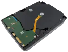 This image shows an oblique view of the back of a Seagate EXOS X18 18 TB HDD