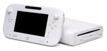 A white Wii U console and gamepad.